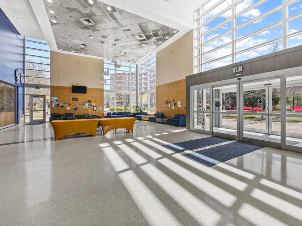 First floor lobby of the Talon Center with seating and large bright windows