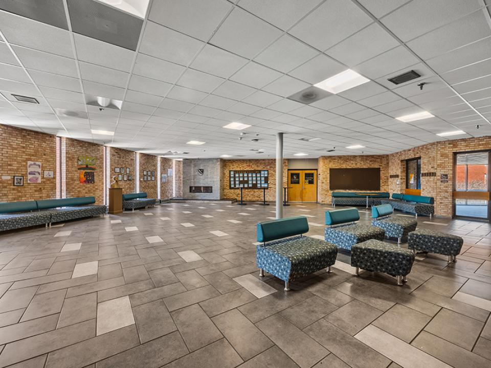 The fireside lounge is an open space with couch seating and a corner fireplace