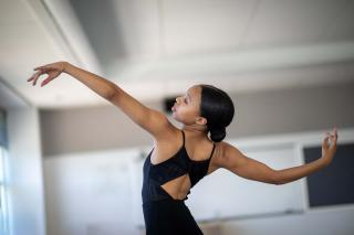 Dance student in black performing