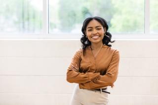 young female businesswoman with a big smile on her face