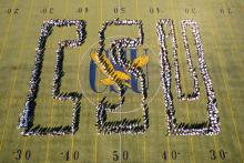 Freshman students lined up in in a formation to spell CSU